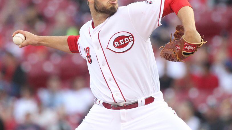 Reds starter Tim Adleman pitches against the Indians on Thursday, May 19, 2016, at Great American Ball Park in Cincinnati. David Jablonski/Staff