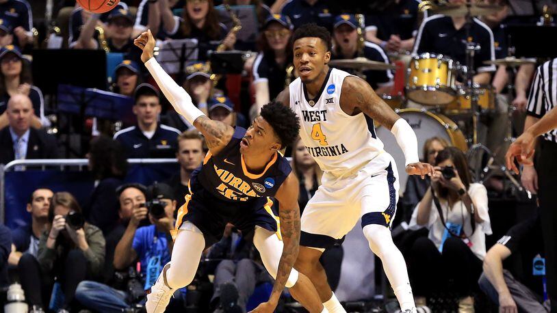 SAN DIEGO, CA - MARCH 16: Ja Morant #12 of the Murray State Racers reaches for a loose ball against Brion Sanchious #4 of the Murray State Racers in the first half during the first round of the 2018 NCAA Men’s Basketball Tournament at Viejas Arena on March 16, 2018 in San Diego, California. (Photo by Sean M. Haffey/Getty Images)