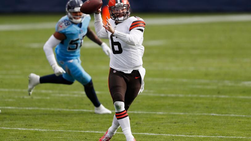 Cleveland Browns quarterback Baker Mayfield (6) throws as he scrambles against the Tennessee Titans in the first half of an NFL football game Sunday, Dec. 6, 2020, in Nashville, Tenn. (AP Photo/Wade Payne)