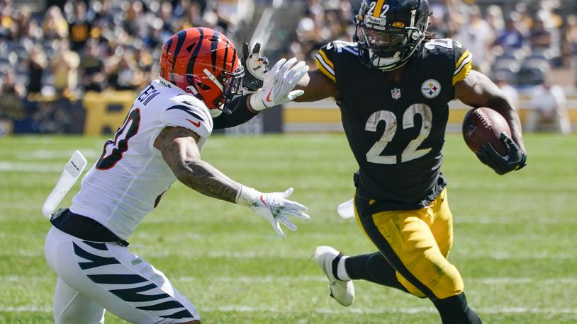 Pittsburgh Steelers running back Najee Harris (22) tries to break away from Cincinnati Bengals free safety Jessie Bates (30) during the first half an NFL football game, Sunday, Sept. 26, 2021, in Pittsburgh. (AP Photo/Gene J. Puskar)