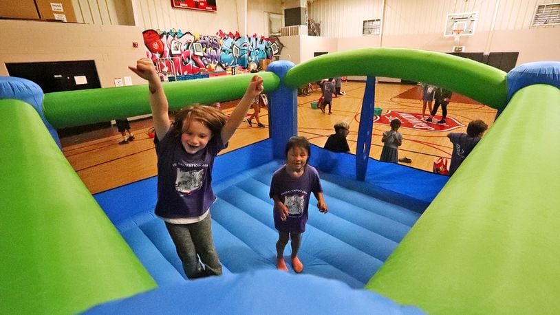 Children bounce around in a bouncy house a few years ago during the Springfield Salvation Army's last day of the Summer Day Camp program for children with disabilities in 2021. BILL LACKEY/STAFF