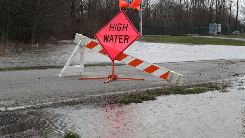 A high water sign surrounded by water on Mitchell Road in Clark County. BILL LACKEY/STAFF