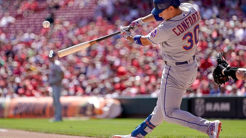 CINCINNATI, OHIO - SEPTEMBER 22: Michael Conforto #30 of the New York Mets hits a 3-run home run during the game against the Cincinnati Reds at Great American Ball Park on September 22, 2019 in Cincinnati, Ohio. (Photo by Bryan Woolston/Getty Images)