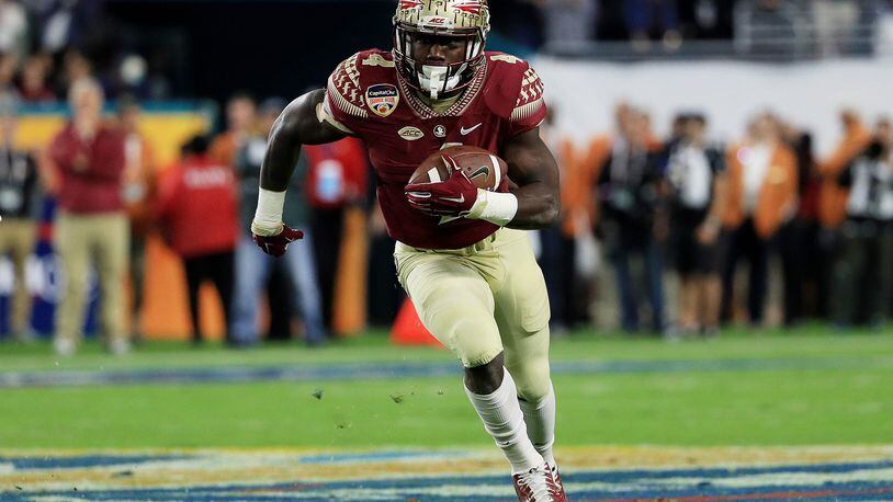 MIAMI GARDENS, FL - DECEMBER 30: Dalvin Cook #4 of the Florida State Seminoles carries the ball in the first quarter against the Michigan Wolverines during the Capitol One Orange Bowl at Sun Life Stadium on December 30, 2016 in Miami Gardens, Florida. (Photo by Mike Ehrmann/Getty Images)