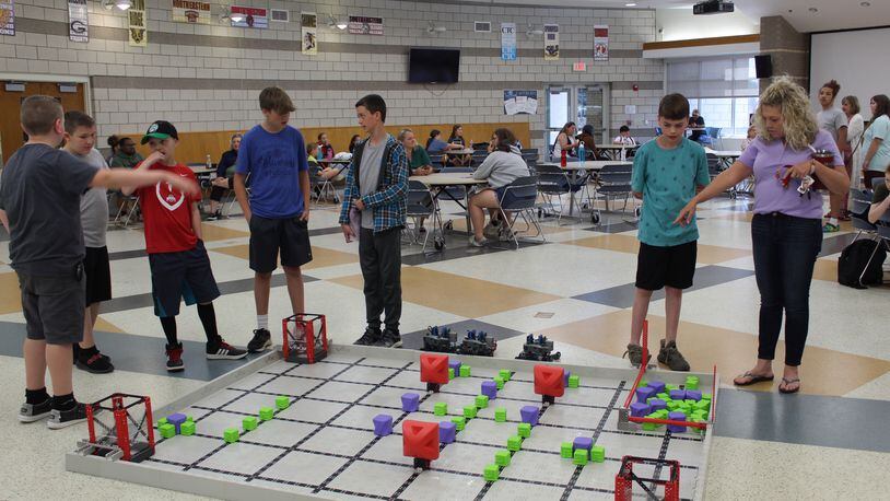 Springfield-Clark Career Technology Center's Future Ready campers in the VEX Robotics camp prepare to showcase the robots they build piece by piece and then coded to run the game field, pick up objects, and deposit objects in a specific area to earn points. Contributed