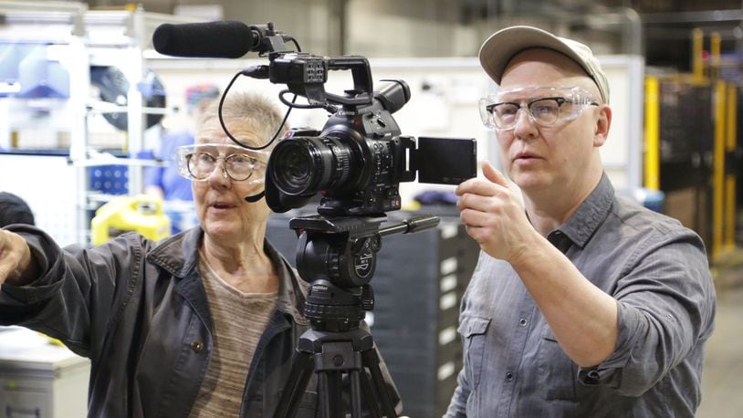 “American Factory” directors Julia Reichert (left) and Steven Bognar filming scenes at Fuyao. DAVID HOLM/NETFLIX