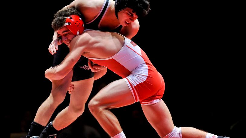 Fairfield’s Zach Shupp (right) competes against Lakota East’s Christian Chavez during a dual match Jan. 14, 2017, at Fairfield High School’s Performing Arts Center. NICK GRAHAM/STAFF
