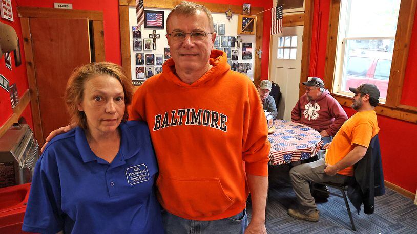 Matt Warner and his wife, Mandie, the owners of Sis's Restaurant in Catawba, in their restaurant. Matt and his wife, Mandie, have decided to close the restaurant due to rising food costs. BILL LACKEY/STAFF