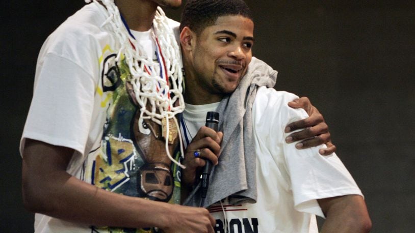 Jefferson High School basketball players Adreian Payne, left, and Cody Latimer celebrate in 2010 after bringing home the Division lV state title. JIM NOELKER / STAFF