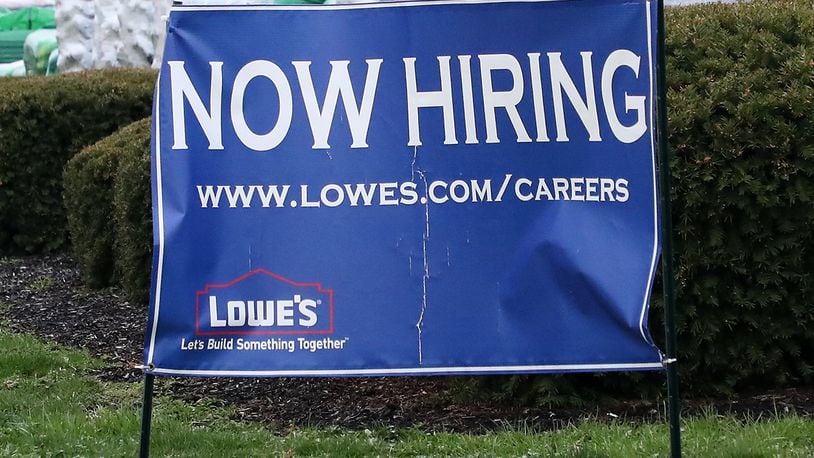 Lowe’s in Springfield had a ‘now hiring’ sign along Bechtle Avenue. BILL LACKEY/STAFF