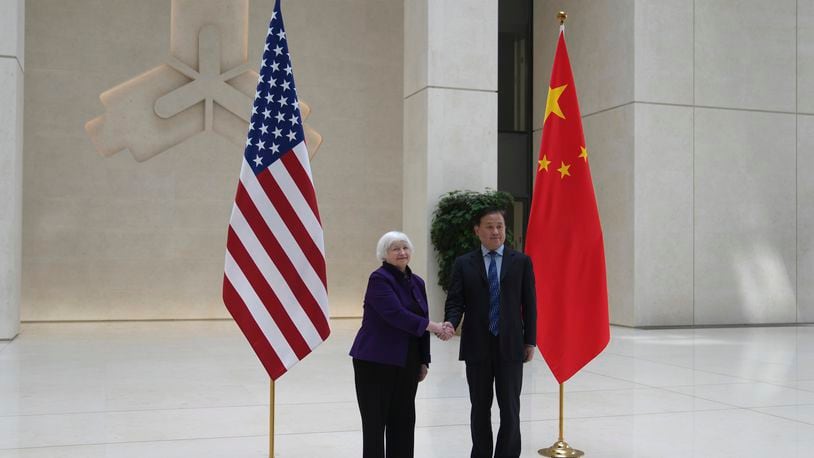 U.S. Treasury Secretary Janet Yellen, left, shakes hands with Governor of the People's Bank of China Pan Gongsheng as they meet at the People's Bank of China in Beijing Monday, April 8, 2024. (AP Photo/Tatan Syuflana, Pool)