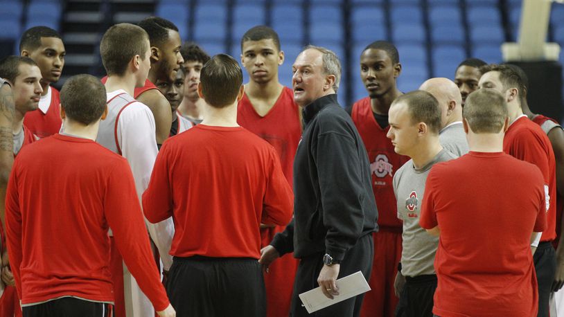 Ohio State’s coach Thad Matta, center, gathers the team in a huddle before practice for the NCAA tournament on Wednesday, March 19, 2014, at First Niagara Center in Buffalo, N.Y. David Jablonski/Staff