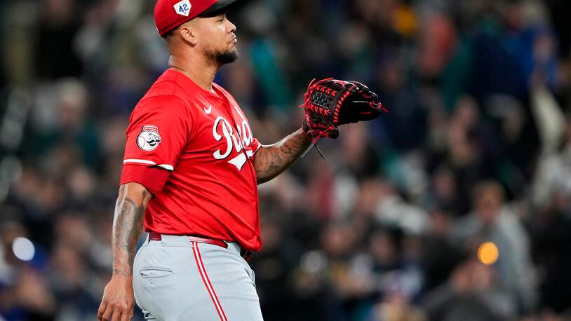 Cincinnati Reds starting pitcher Frankie Montas looks on after giving up a three-run home run to Seattle Mariners' Jorge Polanco during the first inning of a baseball game Monday, April 15, 2024, in Seattle. (AP Photo/Lindsey Wasson)