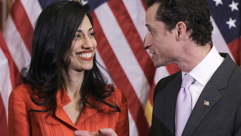 In this photo taken Jan. 5, 2011, then-New York Rep. Anthony Weiner and his wife, Huma Abedin, an aide to then-Secretary of State Hillary Clinton, are pictured after a ceremonial swearing in of the 112th Congress on Capitol Hill in Washington. Democratic presidential candidate Hillary Clinton aide Huma Abedin says she is separating from husband Anthony Weiner after another sexting revelation involving the former congressman from New York. (AP Photo/Charles Dharapak)