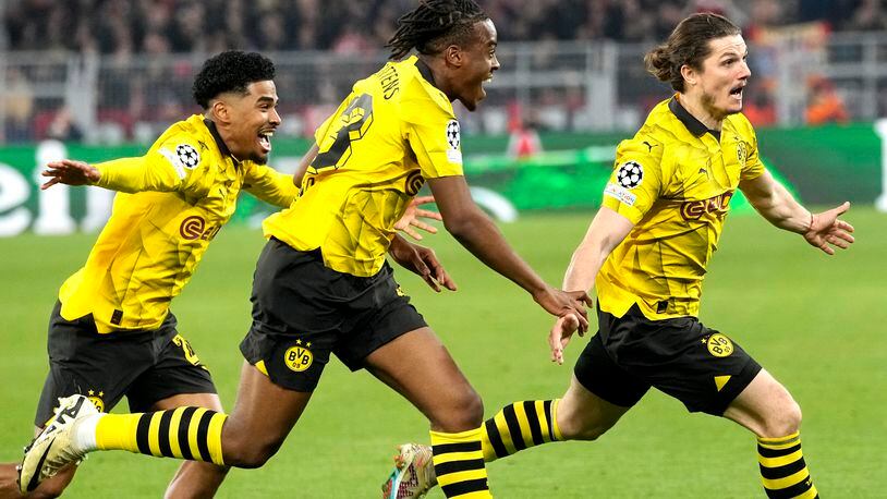 Dortmund's Marcel Sabitzer, right, celebrates his side's 4th goal during the Champions League quarterfinal second leg soccer match between Borussia Dortmund and Atletico Madrid at the Signal-Iduna Park in Dortmund, Germany, Tuesday, April 16, 2024(AP Photo/Martin Meissner)