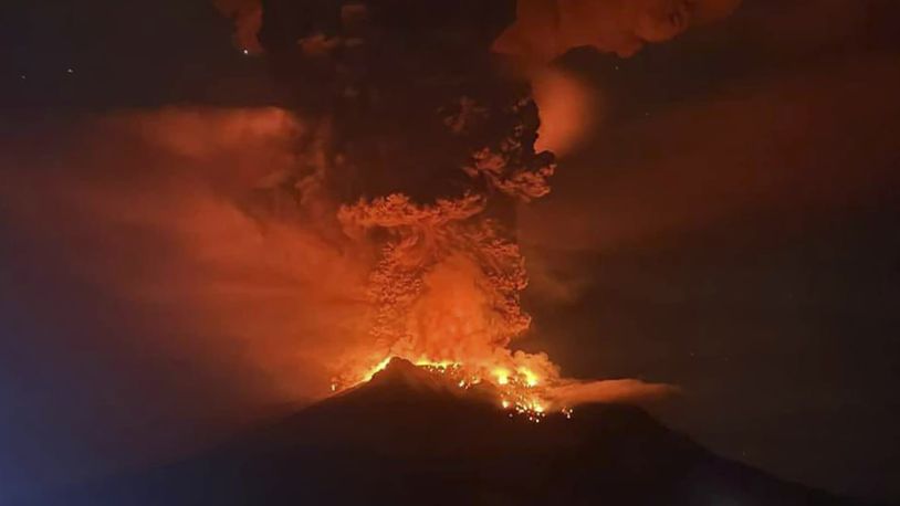 In this photo released by Sitaro Regional Disaster Management Agency (BPBD Sitaro), hot molten lava glows at the crater of Mount Ruang as it erupts in Sanguine Islands, Indonesia, Wednesday, April 17, 2024. Indonesian authorities issued a tsunami alert Wednesday after eruptions at Ruang mountain sent ash thousands of feet high. Officials ordered more than 11,000 people to leave the area. (BPBD Sitaro via AP)