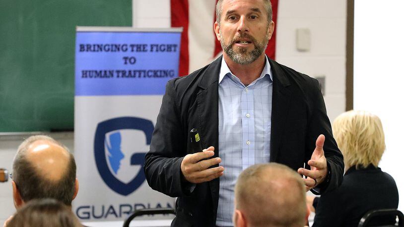Jeff Tiegs, the COO of the Guardian Group, talks to members of the Springfield and Clark County law enforcement during a seminar on human trafficking Thursday at the Springfield Police Department. BILL LACKEY/STAFF