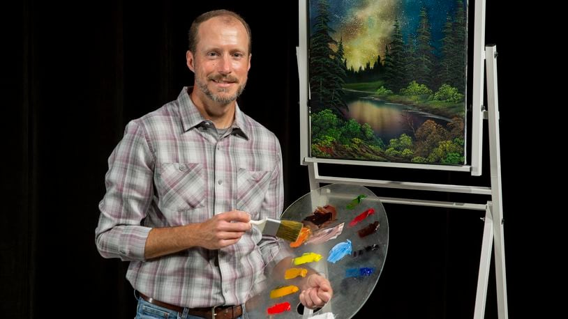 Nicholas Hankins appears in the studio during a taping of "The Joy of Painting with Nicholas Hankins: Bob Ross' Unfinished Season." (Derek Sanford/WDSC-TV via AP)