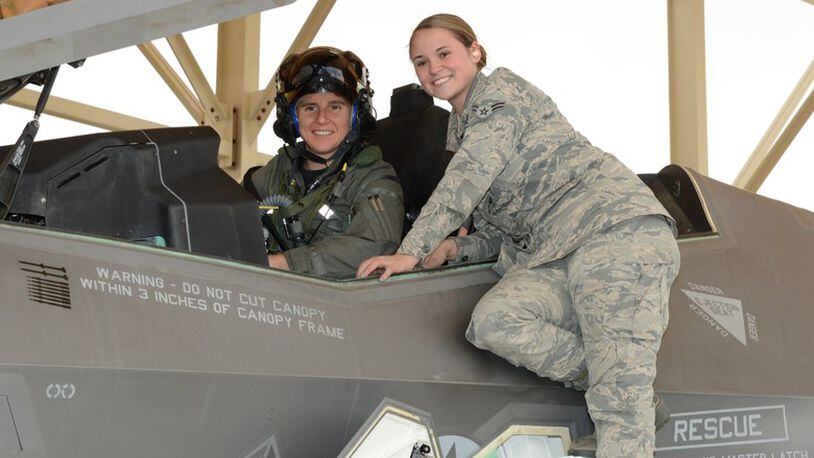 Maj. Rachael Winiecki, 461st Flight Test Squadron F-35 test pilot, and Airman 1st Class Heather Rice, 412th Aircraft Maintenance Squadron crew chief, pose for a photo right after Winiecki landed her F-35 Lightning II on her first test mission flight in the fifth-generation fighter Dec. 14, 2018. (U.S. Air Force photo by Kenji Thuloweit)