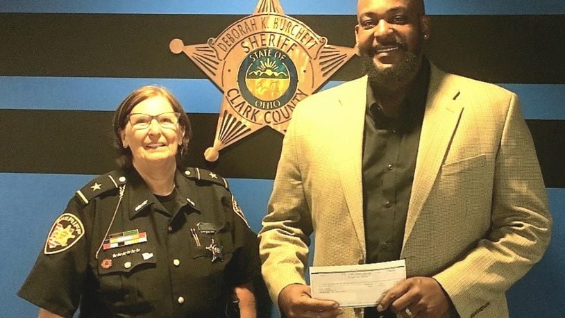 Clark County Sheriff Deb Burchett awarded nearly $20,000 in seized money to nonprofit organizations that focus on alcohol and drug prevention and education programs. Stephen Massey, at right, is the director of operations for CitiLookout in Springfield, which was one of seven grant recipients. CONTRIBUTED