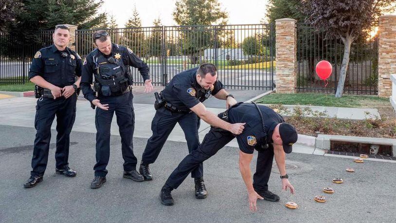 Police officers in Lincoln, California, posted a parody "hot cop challenge" photo on Facebook Friday, Sept. 15, 2017, that takes its inspiration from the wildly popular big screen version of Stephen King's "It."