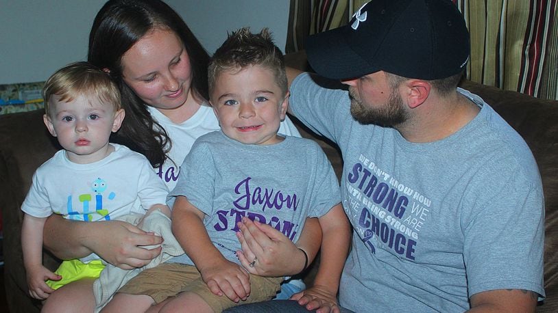 Justin and Lindsey Menda and their children (left) Wesley and Jaxon. Jaxon has a rare disease that only affects 1 in 100 thousand newborns. JEFF GUERINI/STAFF