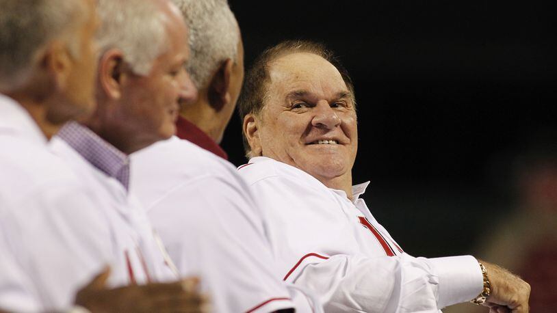 Pete Rose laughs while talking to Dave Concepcion during a ceremony honoring Tony Perez on Friday, Aug. 21, 2015, at Great American Ball Park in Cincinnati. On Monday, Major League Baseball announced it had denied Rose’s reinstatement application. David Jablonski/Staff