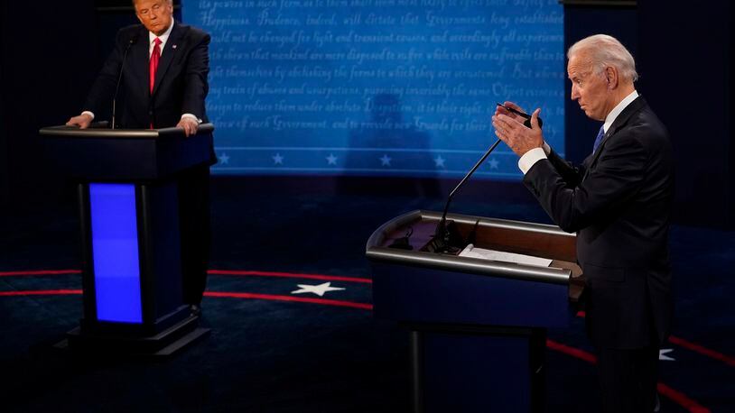 FILE - Democratic presidential candidate former Vice President Joe Biden, right, answers a question as President Donald Trump listens during the second and final presidential debate Oct. 22, 2020, in Nashville, Tenn. Twelve news organizations issued a joint statement calling on the presumptive presidential nominees President Biden and former President Trump to agree to debates during the 2024 campaign. ABC, CBS, CNN, Fox, PBS, NBC, NPR and The Associated Press all signed on to the letter. (AP Photo/Morry Gash, Pool, File)