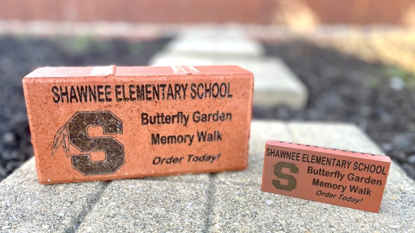 An example of the Clark-Shawnee Elementary Memory Walk brick and replica available for purchase. These 4” by 8” logo bricks can be personalized with up to three lines of text to honor, celebrate, thank, or remember a loved one, family, organization, special occasion, and more. You may also choose to add clip art representing Possum, Reid, Rockway, Clark-Shawnee, a butterfly, or a heart. Contributed/Clark-Shawnee Local Schools