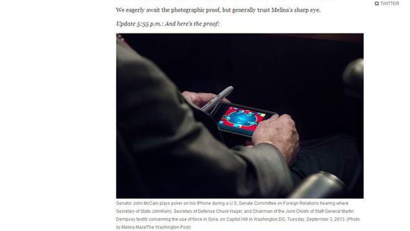 Senator John McCain playing video poker during Syria hearing