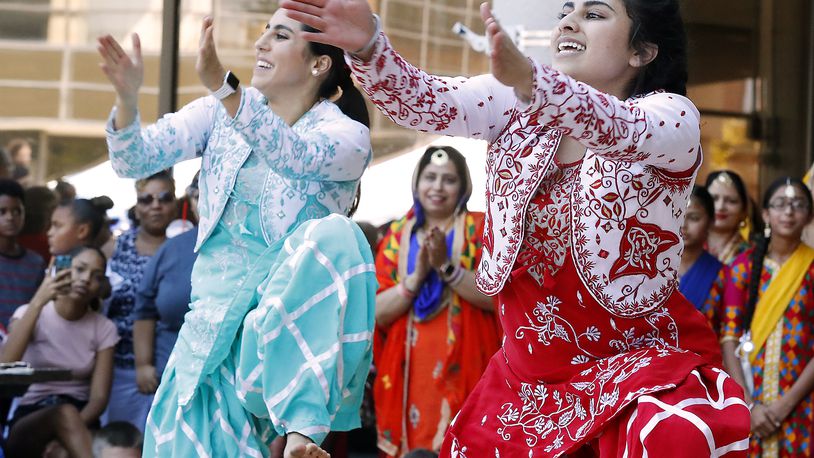 Members of Punjabi Bhangra dance group entertain the crowd with their traditional Sikh dances and clothing at CultureFest in downtown Springfield. Bill Lackey/Staff