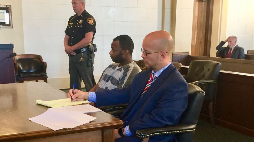 Tyrez Boyd sits with his attorney in Clark County Common Pleas Court Thursday. STAFF PHOTO
