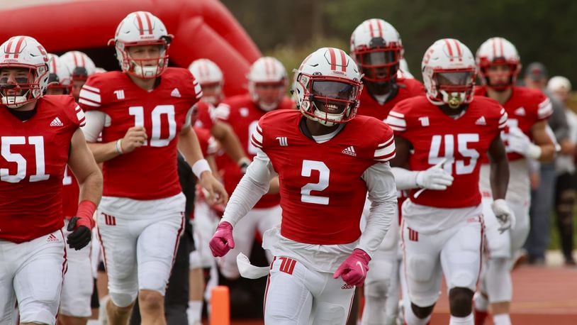 Wittenberg's Gene Nobles runs onto the field before a game against Wabash on Saturday, Oct. 1, 2022, at Edwards-Maurer Field in Springfield. David Jablonski/Staff