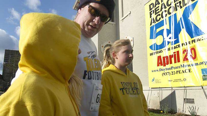 Ryan Brant with his daughters Aubrey, 8, and Ava, 10, at the Dayton International Peace Museum for the 8th annual Dayton Peace Accords 5K run Saturday morning April 20, 2013.