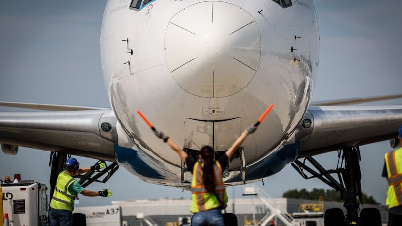 Amazon ground crews position a 767 cargo plan for offload at the Wilmington Air Park. JIM NOELKER/STAFF