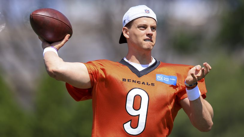 Cincinnati Bengals' Joe Burrow throws a pass as he participates in a drill during an NFL football practice in Cincinnati, Tuesday, May 24, 2022. (AP Photo/Aaron Doster)