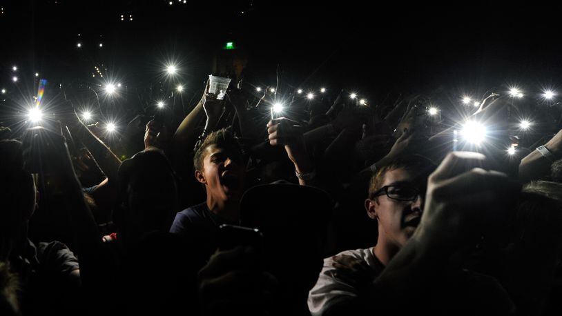 LAS VEGAS, NV - MAY 02: Fans hold up phones with lights as actor/comedian Donald Glover as recording artist Childish Gambino performs at The Chelsea at The Cosmopolitan of Las Vegas during his Deep Web tour in support of the album 'because the internet' on May 2, 2014 in Las Vegas, Nevada. (Photo by Ethan Miller/Getty Images)