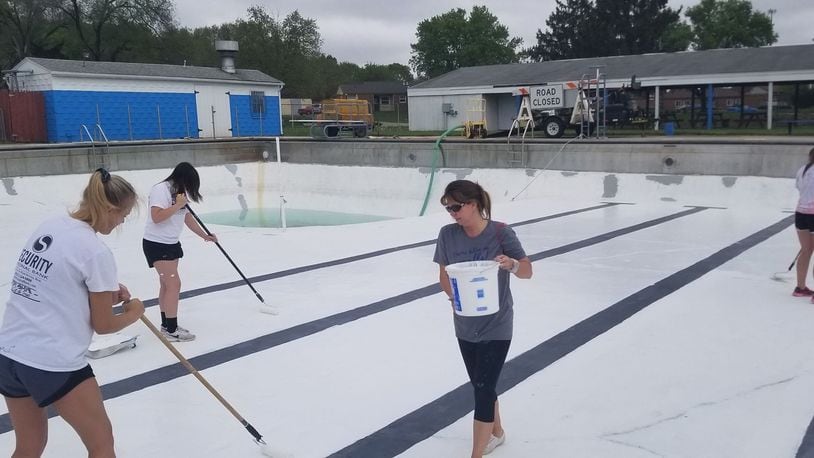 Pool volunteers painted the bottom of the drained swimming pool on Sunday May 5. Submitted by Pool Manager April Lowry.