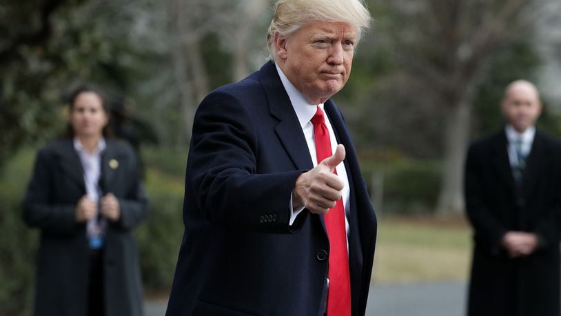 President Donald Trump gives the thumbs-up as he leaves the White House on Feb. 3, heading for Mar-a-Lago, his estate in Palm Beach, Fla. Trump has spent four weekends at the estate since his inauguration on Jan. 20.