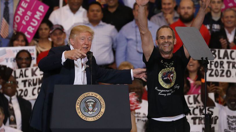 President Donald Trump introduces Gene Huber on stage during a speech and rally at the AeroMod International hangar at Orlando Melbourne International Airport on February 18, 2017 in Melbourne, Florida.