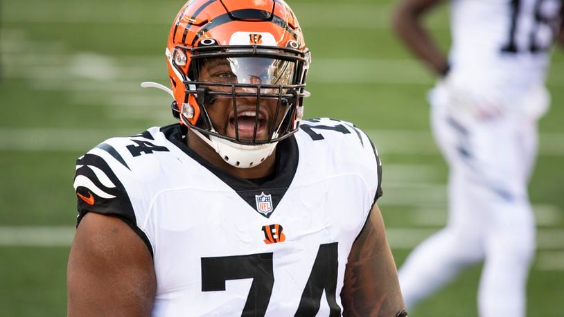 Cincinnati Bengals offensive guard Fred Johnson (74) reacts after a touchdown by Giovani Bernard in the first half of an NFL football game against the Tennessee Titans, Sunday, Oct. 4, 2020, in Cincinnati. (AP Photo/Emilee Chinn)