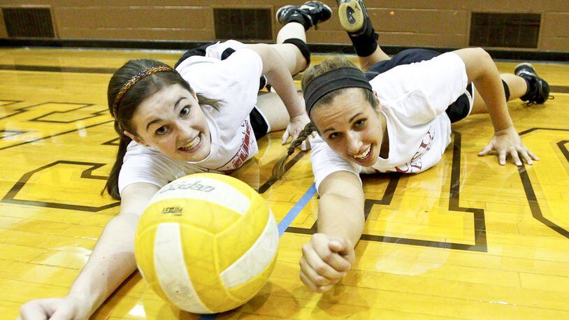 Senior middle hitter Karrah Batten (right) and junior outside hitter Taylor Brown (left), both three-year varsity standouts, are key members of the Kenton Ridge H.S. volleyball team. Staff photo