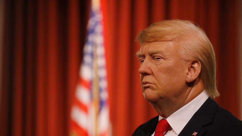 The wax figure of US President-elect Donald Trump debuted at Madame Tussauds in London Wednesday, Jan. 18, 2017, days ahead of the American's Presidential Inauguration in Washington. (AP Photo/Frank Augstein)