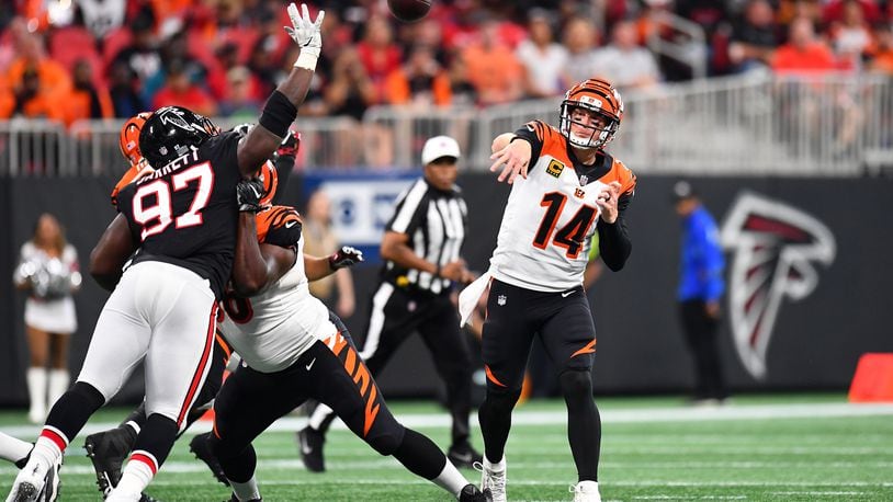 Andy Dalton #14 of the Cincinnati Bengals throws a pass during the first quarter against the Atlanta Falcons at Mercedes-Benz Stadium on September 30, 2018, in Atlanta, Georgia. (Photo by Scott Cunningham/Getty Images)