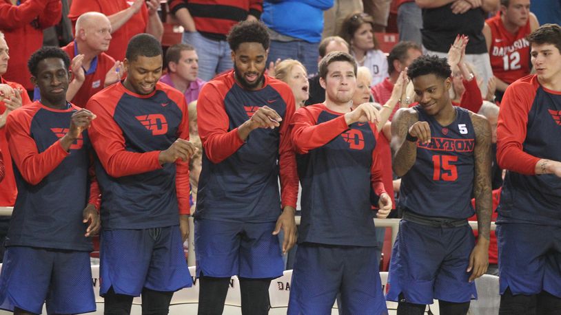 Dayton players (left to right) Jeremiah Bonsu, Trey Landers, Josh Cunningham, Joey Gruden and John Crosby react on the bench to a made free throw in overtime against Davidson on Friday, Feb. 24, 2017, at Belk Arena in Davidson, N.C. David Jablonski/Staff