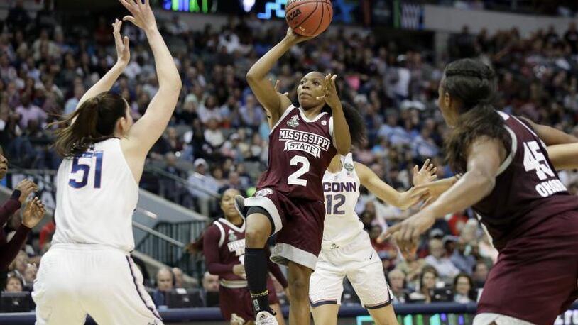 Morgan William (2) of Mississippi State puts up the game-winning shot as the Bulldogs stunned four-time defending champion Connecticut in overtime Friday night.