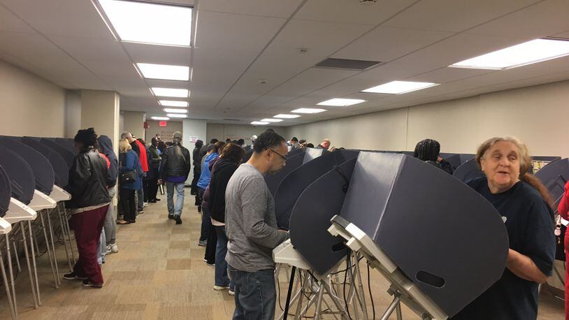 Ohio Secretary of State Jon Husted is calling for state legislators to spend $118 million replacing voting machines in Ohio’s 88 counties. Here early voters cast their ballots on electronic voting machines at the Montgomery County Board of Elections in 2016 . LYNN HULSEY/staff writer