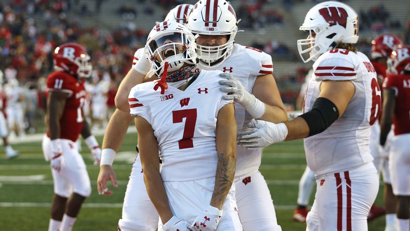 Wisconsin wide receiver Danny Davis III (7) reacts after scoring a touchdown against Rutgers during the second half of an NCAA college football game, Saturday, Nov. 6, 2021, in Piscataway, N.J. Wisconsin defeated Rutgers 52-3. (AP Photo/Noah K. Murray)