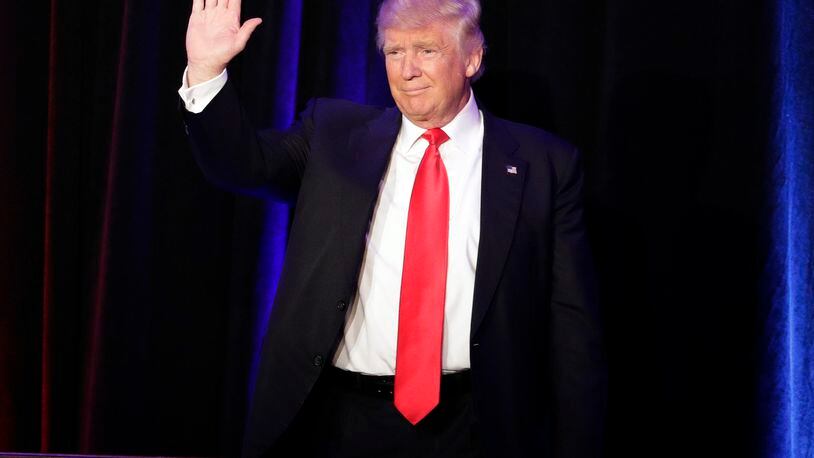 President-elect Donald Trump waves as he arrives at his election night rally, Wednesday, Nov. 9, 2016, in New York. (AP Photo/John Locher)
