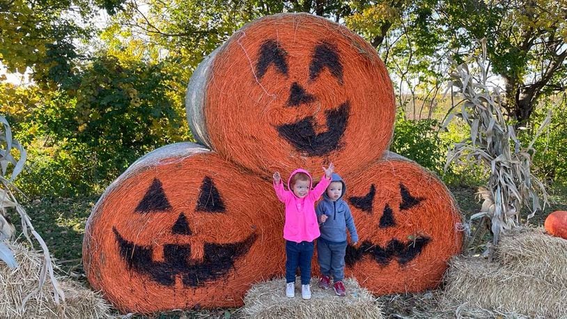 Twins from Springfield, Stella and Holden Lynch, pose for Halloween photos at Old Thyme Growers. Photos by Pam Cottrel